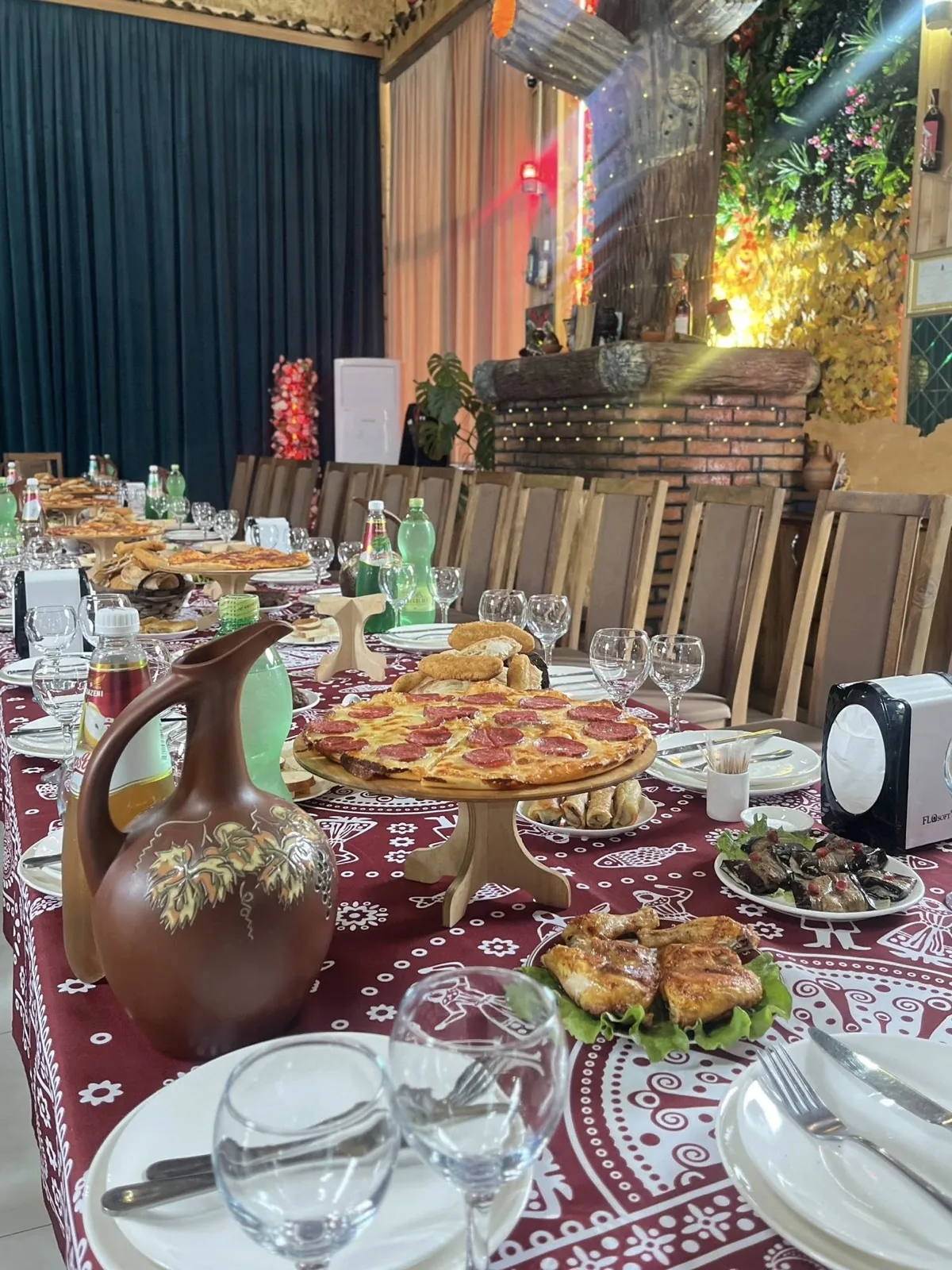 A full Georgian supra at CHAKURA - khachapuri, fresh plates and a clay wine jug