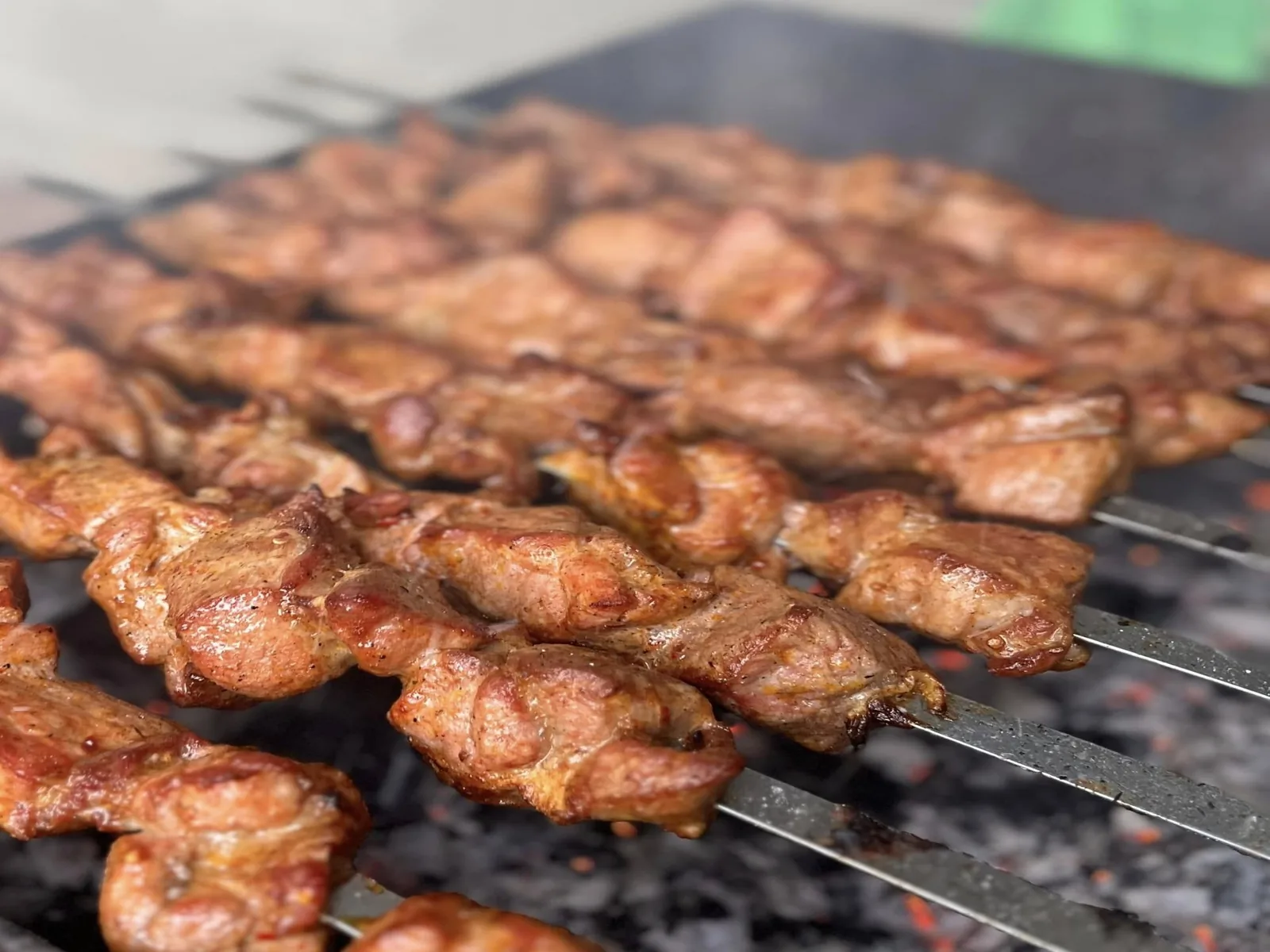 Mtsvadi skewers grilling over real wood at CHAKURA